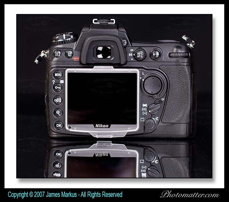 Picture of the Nikon D300 camera body
showing the large 3 inch LCD, buttons, and dials